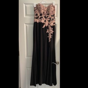Black and pink corset style strapless prom dress.